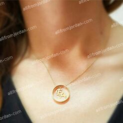 Custom made necklace with ring pendant containing your initials.